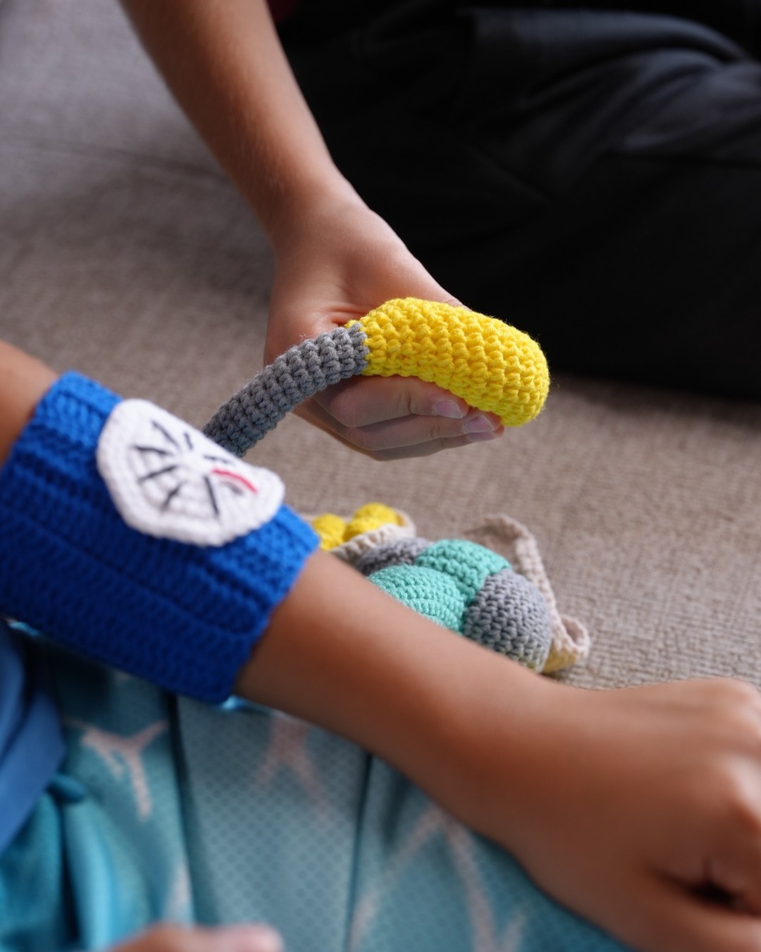 Crochet blood pressure cuff and bulb in pretend play